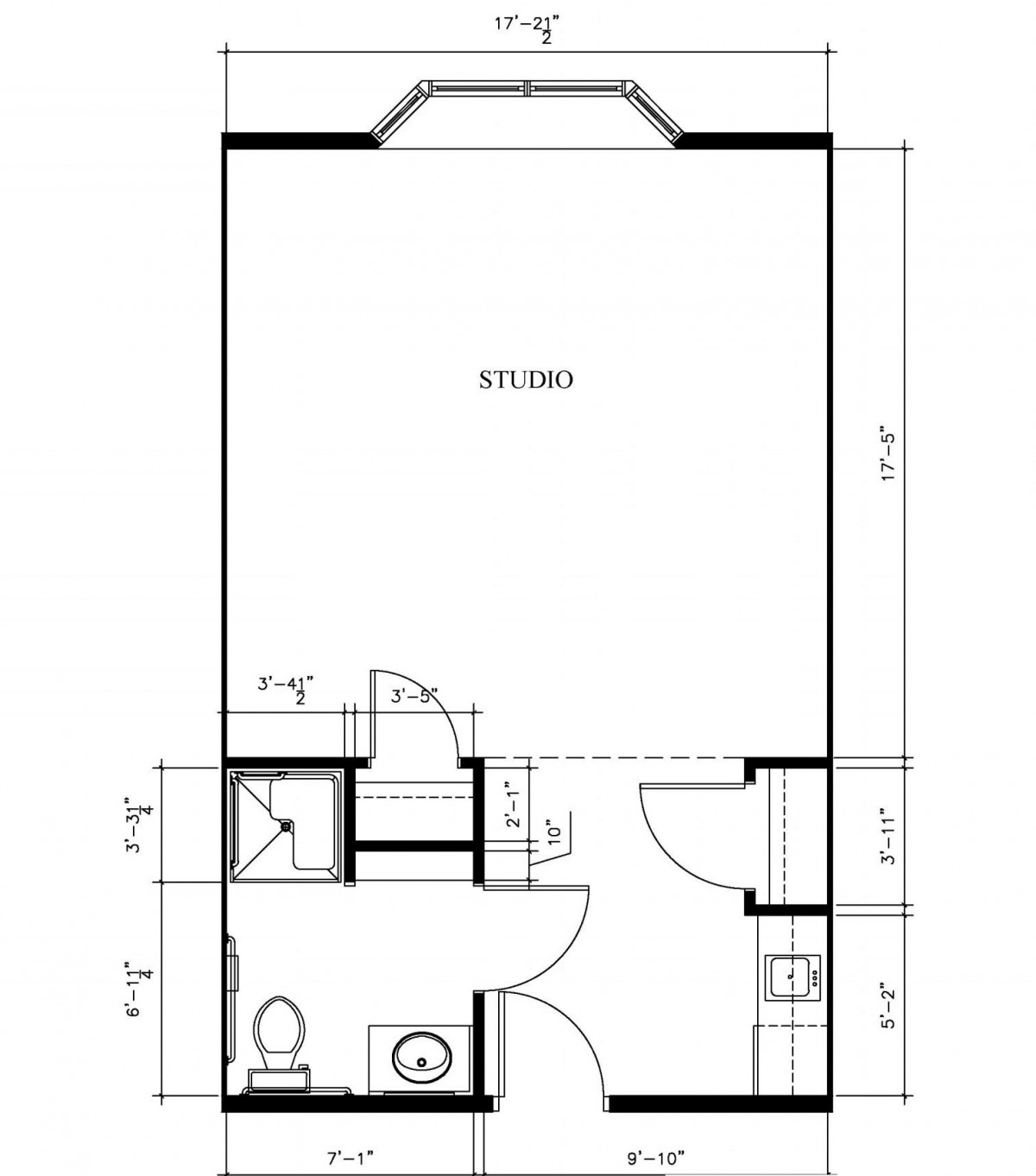 A floor plan illustrating the layout of a space including a bathroom and a studio area.