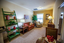 A cozy living room with comfortable seating and warm lighting.