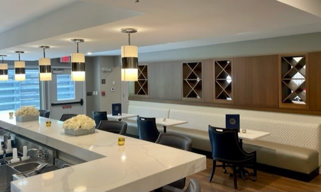 A modern and stylish dining area with sleek seating and contemporary lighting.