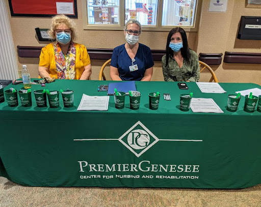 Healthcare professionals representing Premier Genesee at an event.