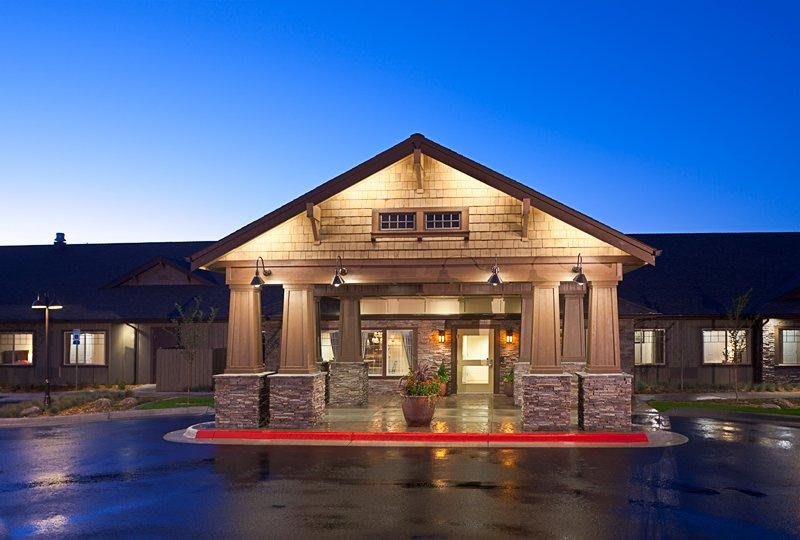A well-lit hotel entrance at night.