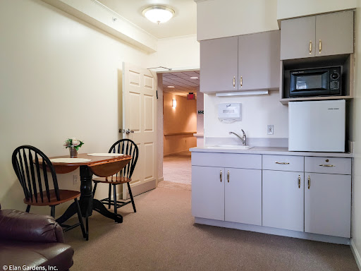 A cozy kitchenette and dining area in a bright apartment.