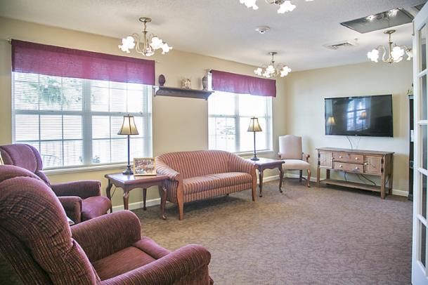 A cozy living room with comfortable furniture and natural lighting.