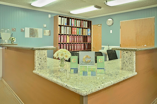 A welcoming reception area with organized shelves and decorative flowers.