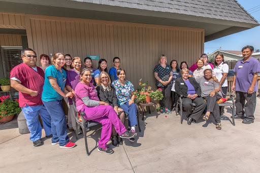 A dedicated team of healthcare professionals gathered for a group photo.