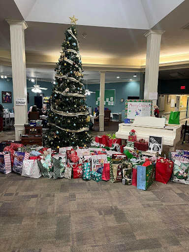 A festive display of wrapped gifts surrounding a beautifully decorated Christmas tree.