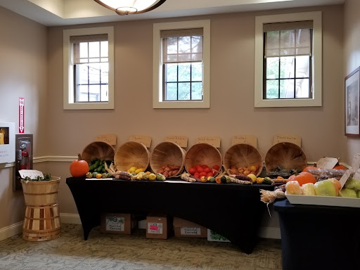 A festive display of autumn-themed food items and decorative baskets arranged on a table.
