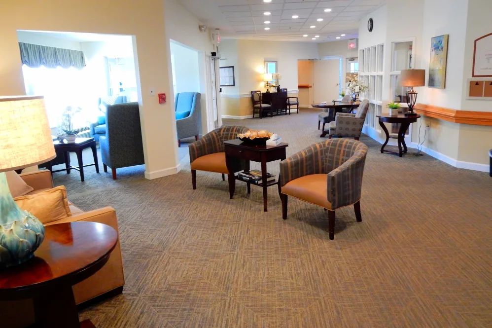 A spacious lobby with comfortable seating areas and soft lighting.