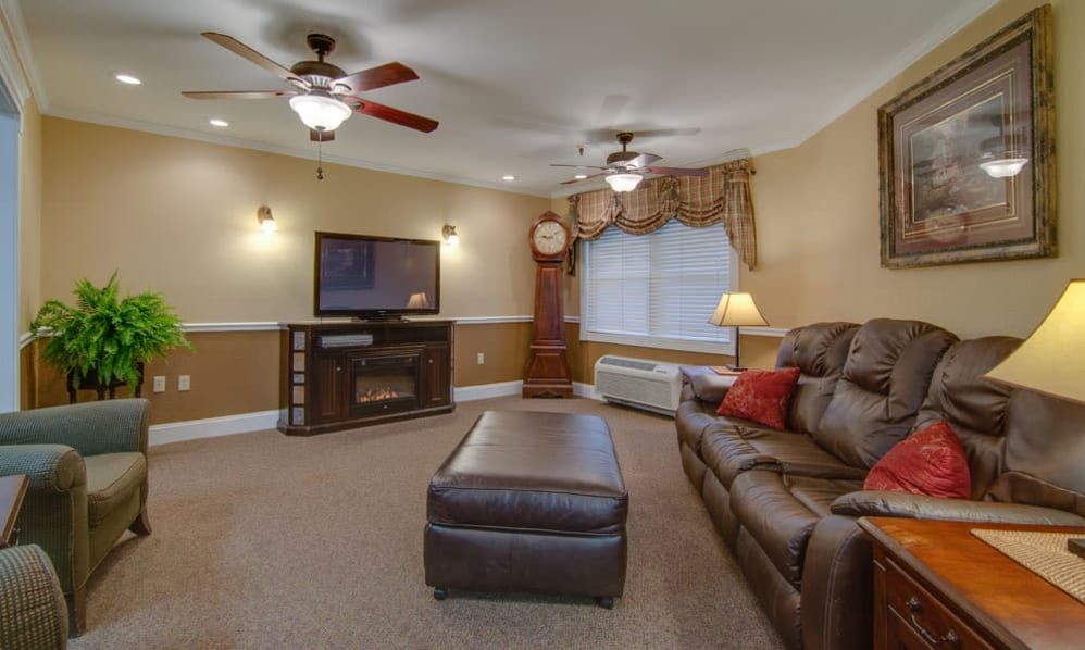 Cozy living room with a sofa, coffee table, and entertainment setup.