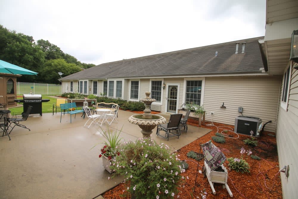 A spacious patio area with outdoor furniture and garden landscaping.