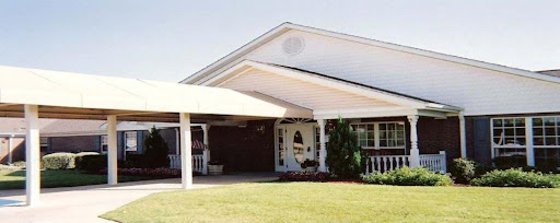 A charming single-story house with a well-maintained front yard and a welcoming entrance.