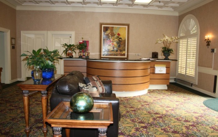 A welcoming office lobby with a reception desk and comfortable seating.