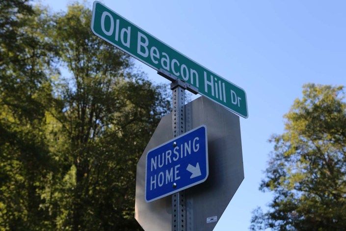 Street signs indicating Old Beacon Hill Drive and a nursing home nearby.