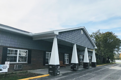 A modern building entrance featuring distinct columns and a sleek design.