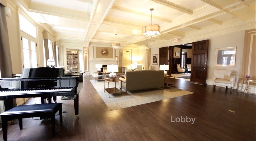 A spacious and elegantly designed lobby with comfortable seating and warm lighting.