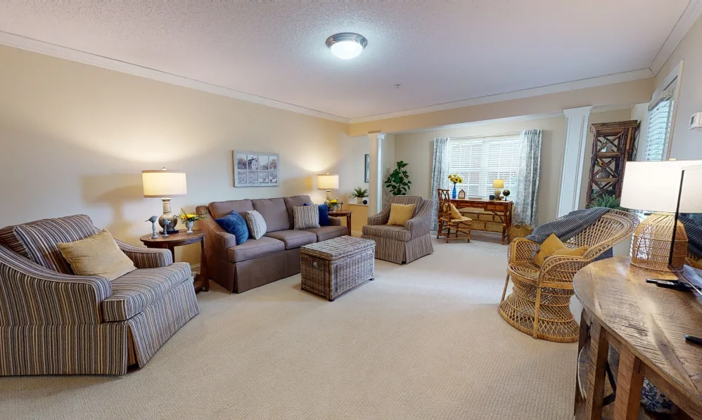 A cozy living room with comfortable seating and natural light.