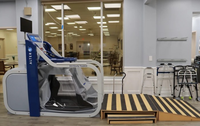A specialized treadmill setup in a physical therapy clinic for rehabilitation exercises.