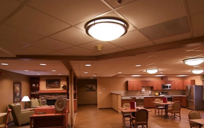 A cozy kitchen and dining area with warm lighting.