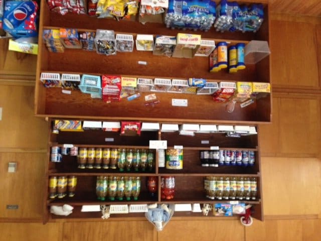A vending machine displaying a variety of snacks and beverages.