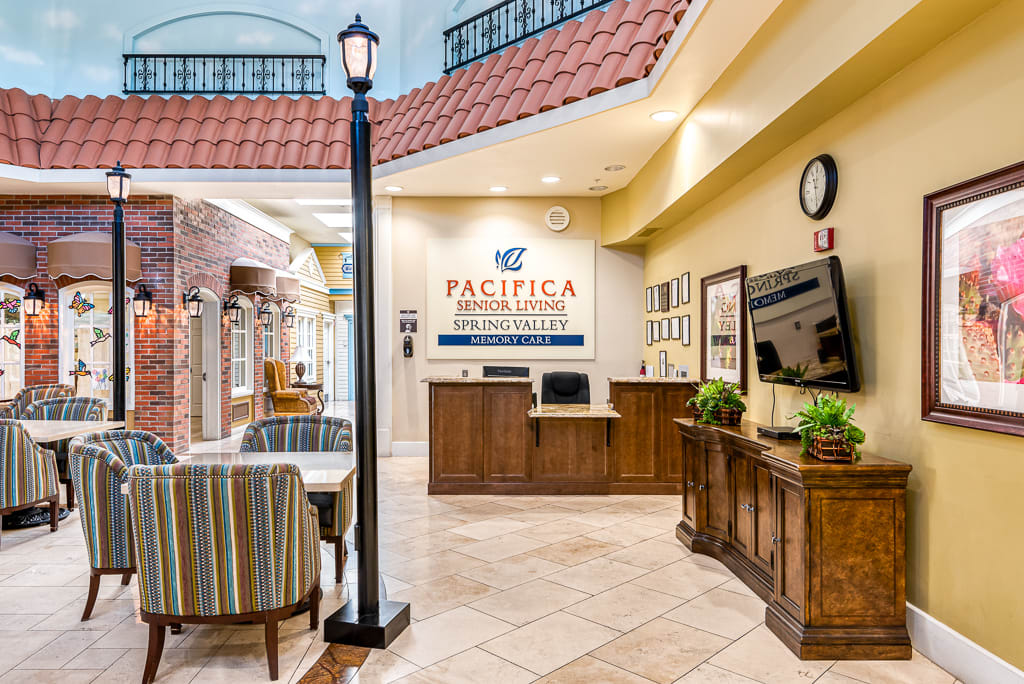 A welcoming reception area with comfortable seating and a neatly arranged information desk.