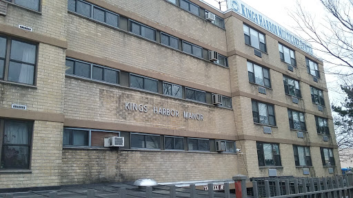 Exterior view of a brick building with prominent signage.