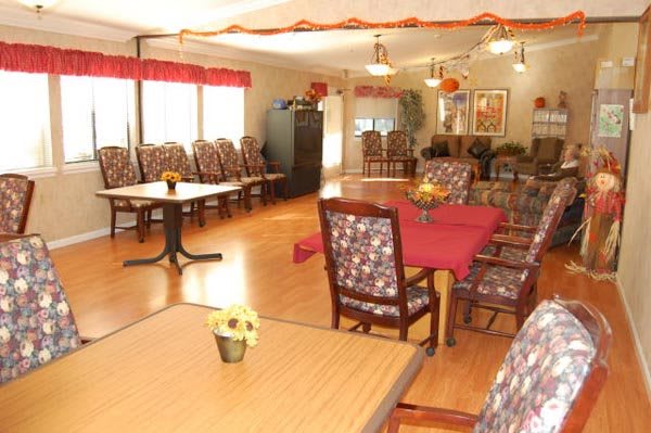 A well-decorated dining room with tables and chairs arranged for a communal setting.