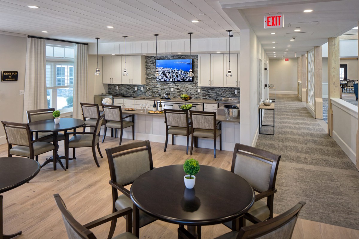 A modern kitchen and dining area featuring contemporary furnishings and decor.