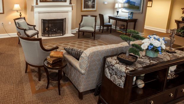 A cozy living room with elegant furniture and a fireplace.