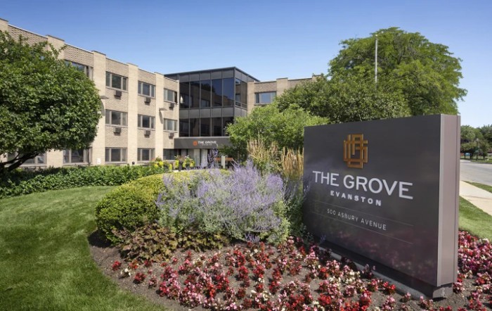 The Grove, a well-landscaped building with prominent signage and modern architecture.