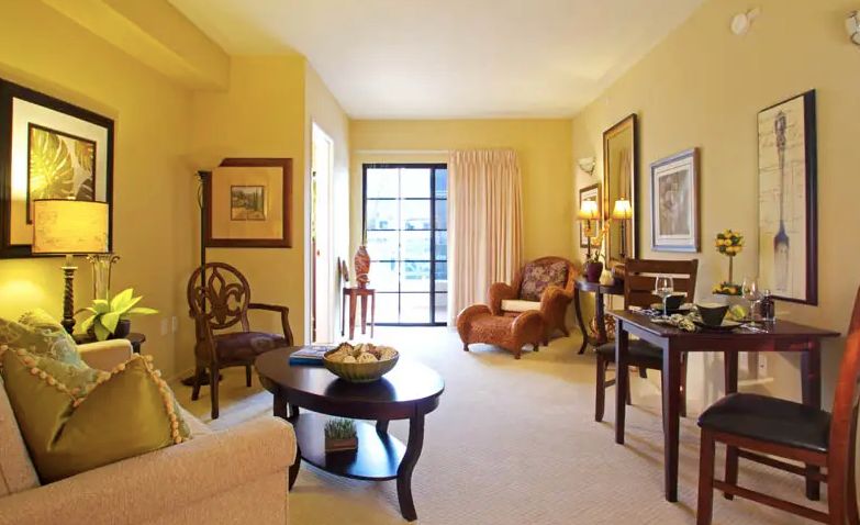 A cozy living room with warm colors and natural lighting.
