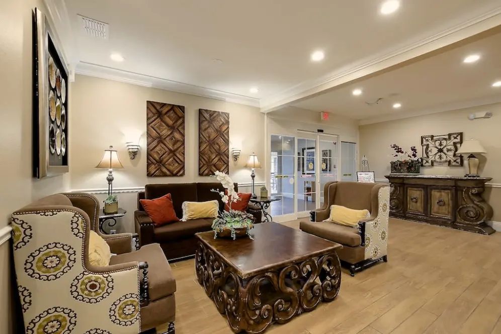 A cozy and elegant living room with stylish furniture and warm lighting.