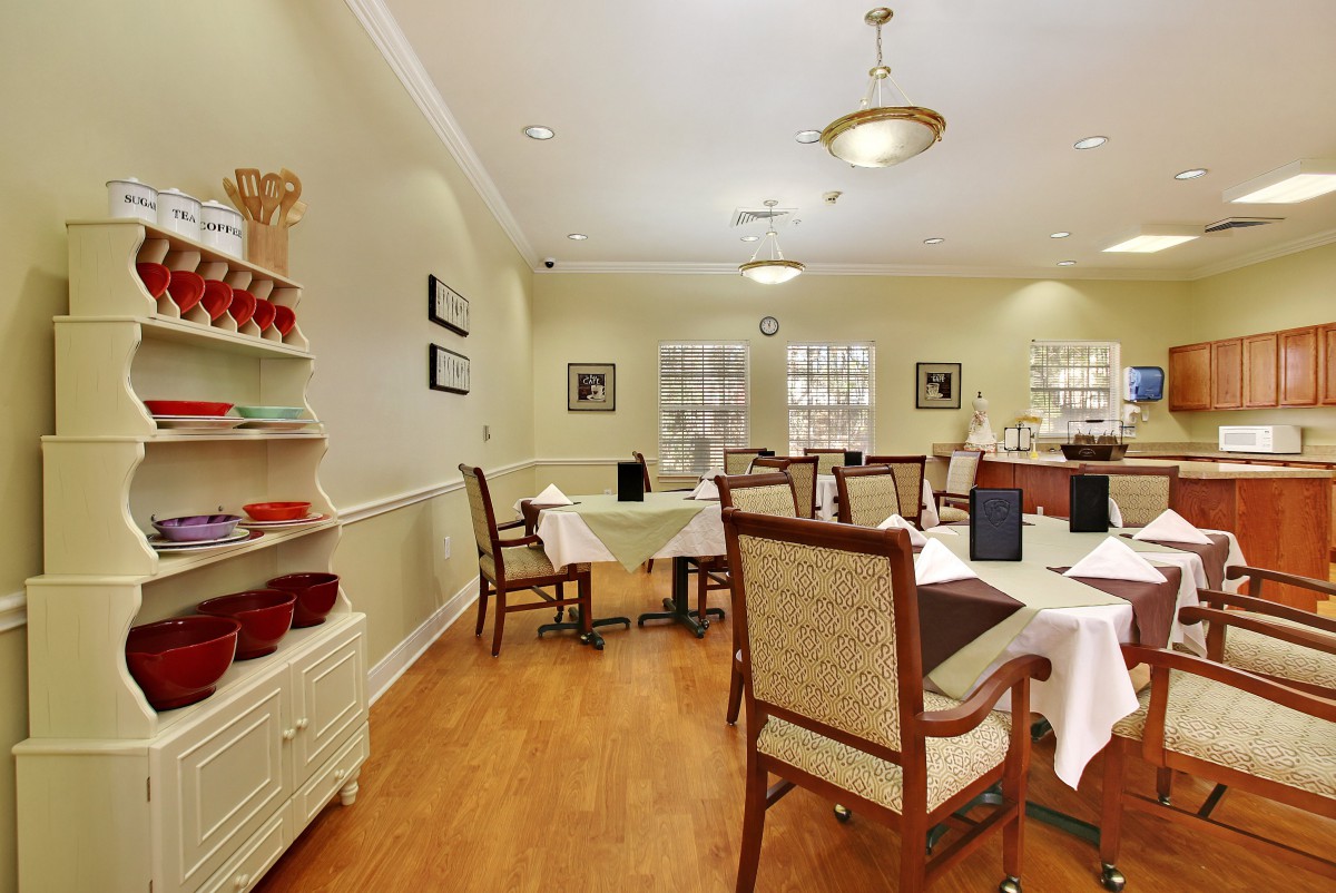Cozy dining area with neatly arranged tables and chairs.