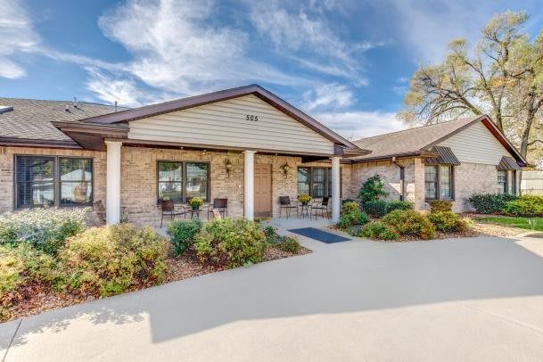 A well-maintained house exterior with landscaped garden.