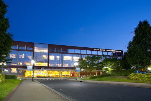 A modern building illuminated at night, showcasing contemporary architectural design.