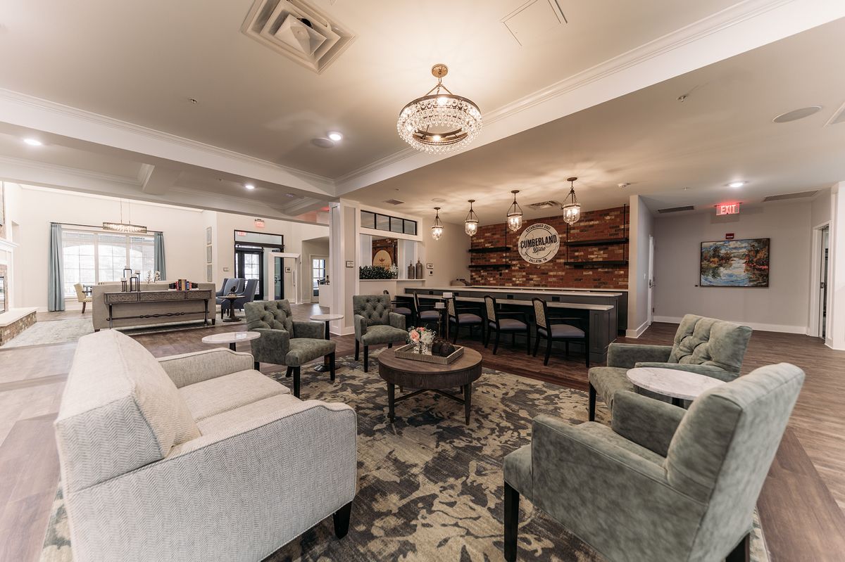 A modern living room with comfortable seating and elegant decor.