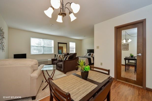 A cozy living and dining area with stylish furniture and a warm ambiance.