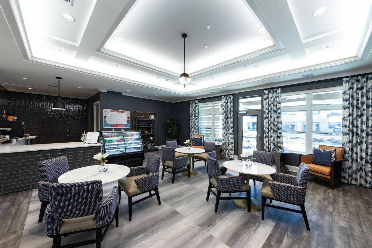 A modern cafe interior with elegant seating and stylish lighting.