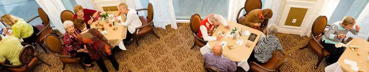 Two people sitting at a table engaged in conversation.