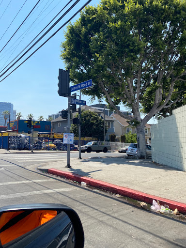 A bustling urban intersection on a sunny day.