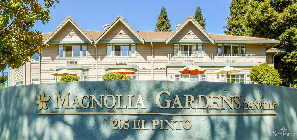 Magnolia Gardens residential building with signage in front.