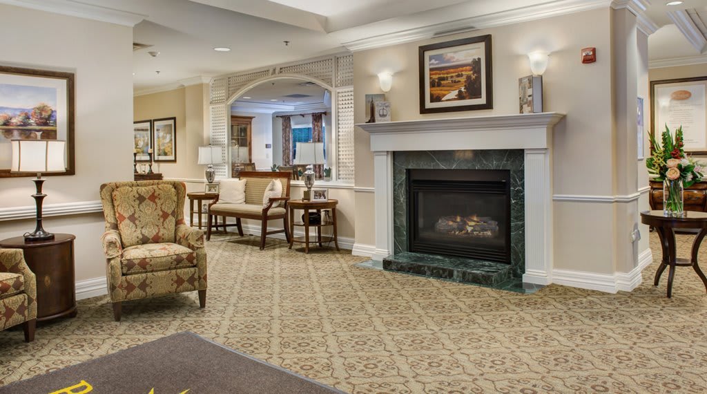 A cozy living room with a fireplace and comfortable seating.