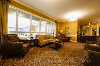 A cozy living room with comfortable seating and warm lighting.