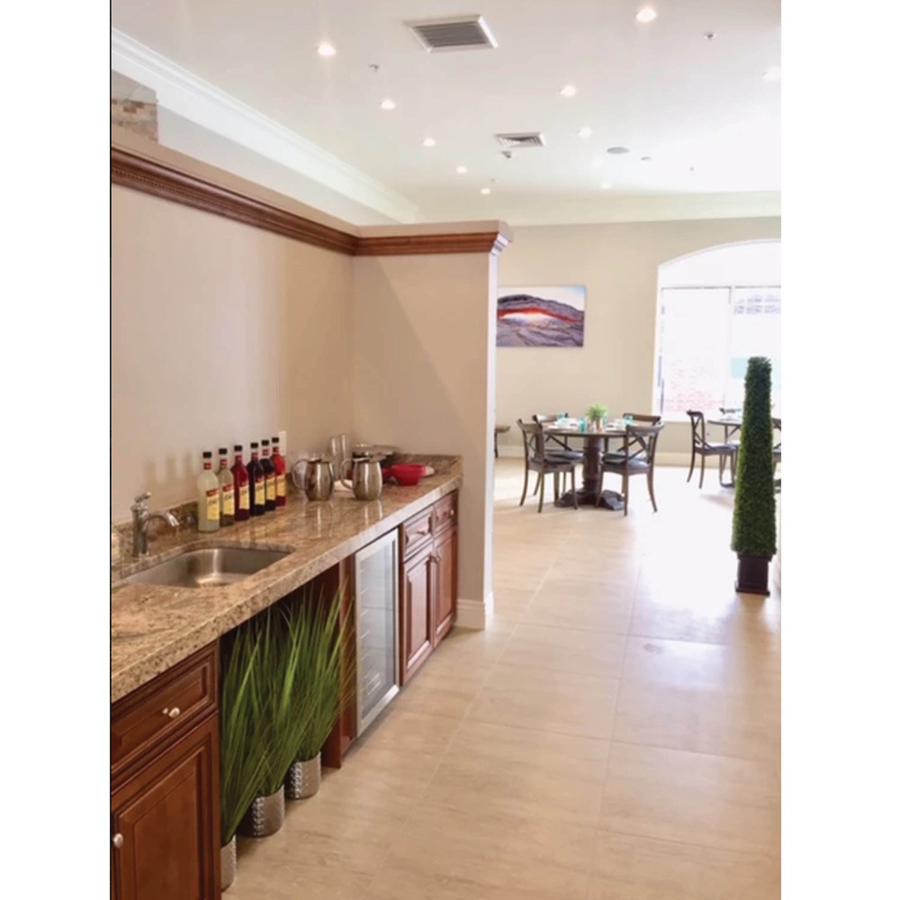 Modern restaurant interior with a bar counter and dining area.