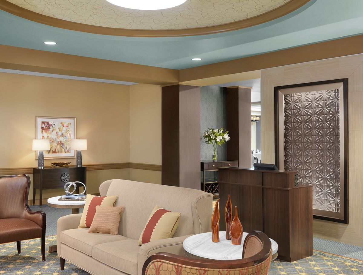 A cozy lobby area featuring comfortable seating and elegant decor.