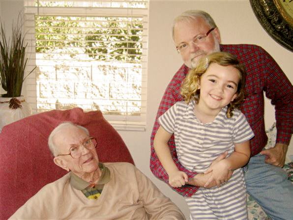 A joyful family moment with multiple generations together indoors.