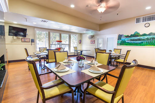 A cozy dining area featuring modern furnishings and ample natural light.