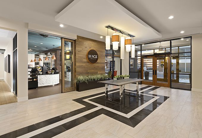 A modern lobby area featuring stylish decor, contemporary lighting, and a welcoming entrance.