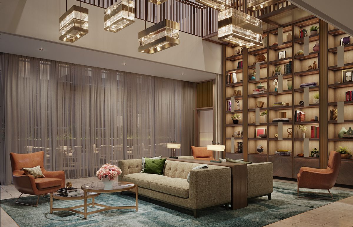 A luxurious modern living room with a sleek sofa, elegant lighting, and an impressive wall of bookshelves.