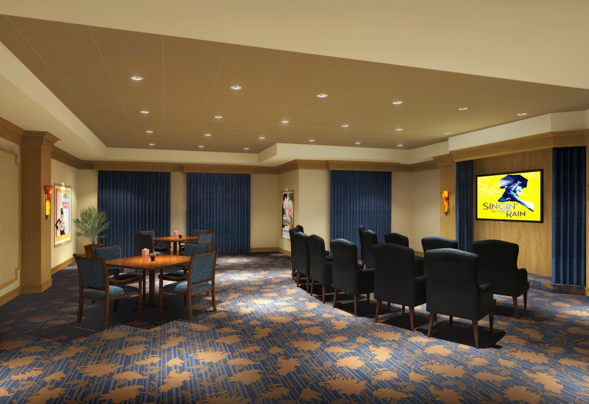 A spacious conference room with a large table, surrounded by chairs and featuring a patterned carpet.