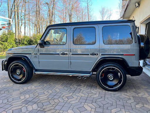 A sleek gray Mercedes-Benz G-Class parked gracefully in a scenic outdoor setting.
